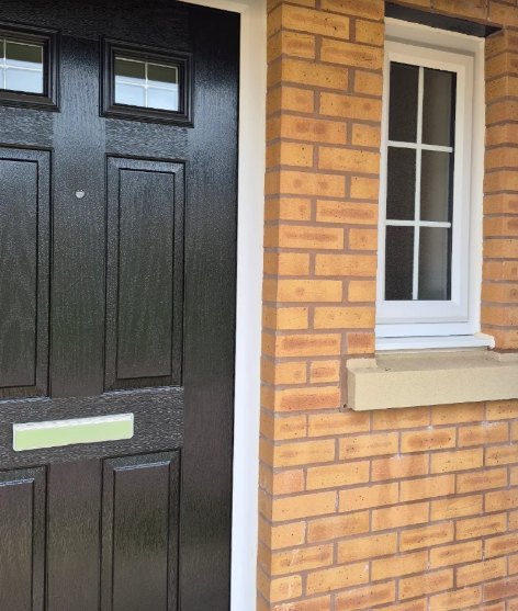 Clean front door and window on a Northampton home
