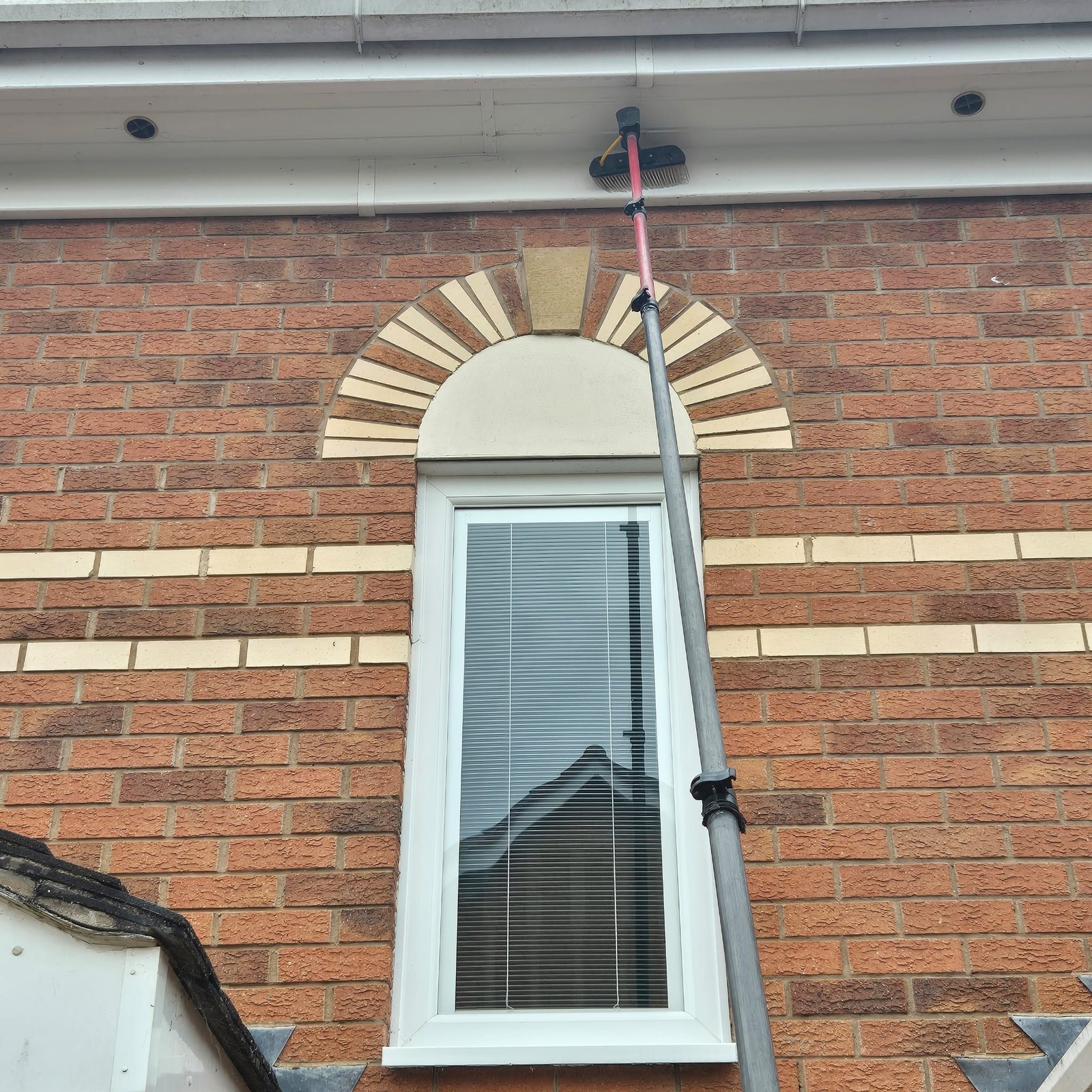 Close up of a soffit being brushed clean